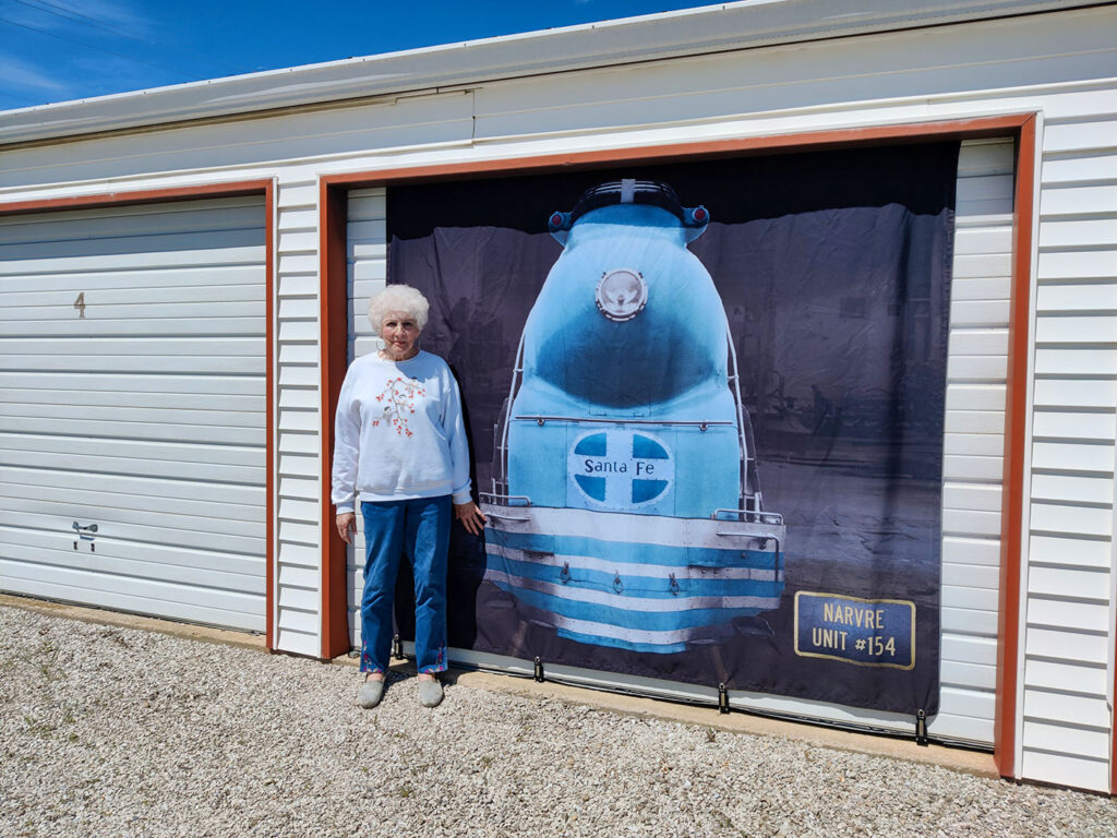 Trudy Eads with "Blue Goose" banner | Downtown Marceline Foundation